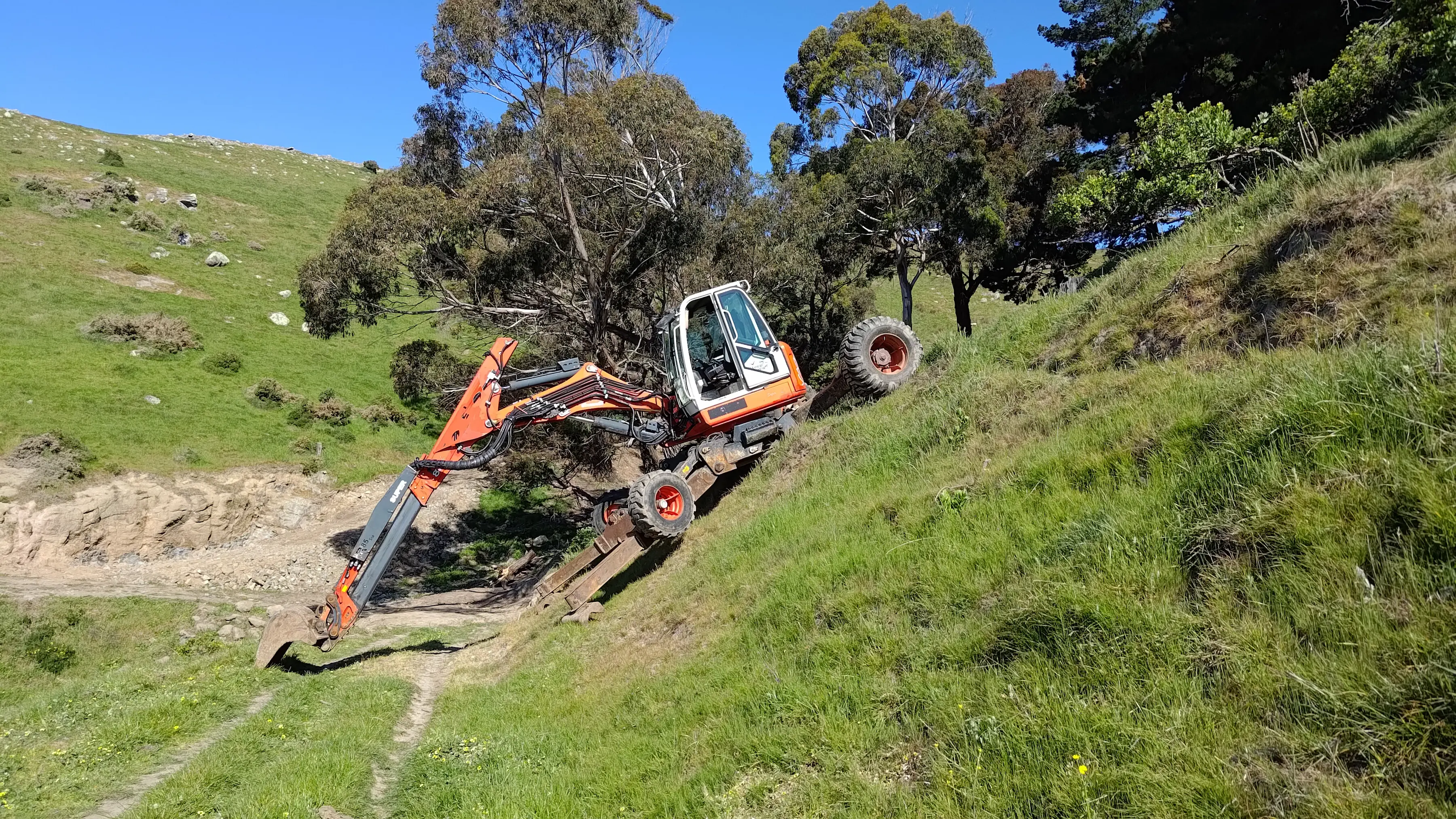 Spider digger working on hillside in Canterbury